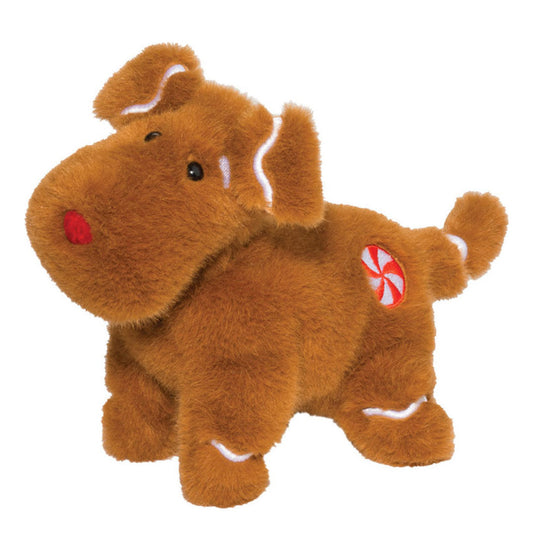 Das ist ein Lebkuchenhund von Douglas Cuddle Toys. Ein kleiner Hund mit dichtem, leicht zotteligem, glänzendem Fell in Braun, mit weißen Akzenten an den Ohreninnenseiten, den Ohrkrausen, am Schwanzring und über den Pfoten. Schnauze, Bauch und Pfoten sind braun. Die schwarzen Augen stehen eng beieinander, die Nase ist rund und rot. Auf der rechten Flanke sitzt ein gestickter rot-weißer Pfefferminzfleck. Er steht auf vier Beinen, hält nichts und blickt sanft und neugierig.